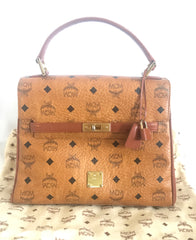Vintage MCM classic brown monogram Kelly bag with golden logo plate. Perfect daily use bag. By Michael Cromber, Germany