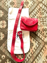Vintage CHANEL red leather belt bag, fanny pack with detachable chain belt and CC stitch mark on flap. Fits 29.5" through 32.8"