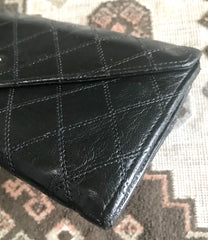 1980s. Vintage CHANEL black goatskin bill, card, checkbook long wallet pouch purse with mini CC motif. Classic unisex style.