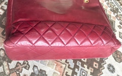 Vintage CHANEL wine leather tote bag with gold chain handles and CC motif charm. Classic purse.