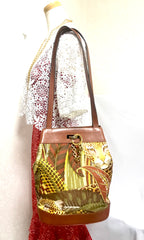 Vintage Salvatore Ferragamo leopard in safari jungle print brown leather hobo shoulder bag with golden gancini motif. Must have.