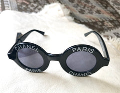 Vintage CHANEL black round frame mod sunglasses with white CHANEL PARIS logo. 060412