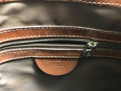 Vintage FENDI brown leather hobo bucket, shoulder bag with drawstring and iconic Janus medallion embossed motif at front. Unisex. Rare bag.