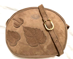 Vintage Longchamp brown suede leather oval round shape shoulder bag with leaf applique motifs. Rare and unique bag back in the okd era.