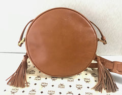 Vintage MCM suzy wong bag, brown grained leather round shoulder bag with studs and fringes. Designed by Michael Cromer. Nature. 060531r8