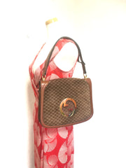 Vintage Gucci brown leather micro GG print shoulder bag with iconic golden large round GG motif. Rare masterpiece purse.