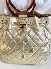 Vintage CHANEL campaign gold lamb leather hobo bucket bag with marble hoop handles and turn lock CC. 0412081