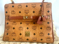 Vintage MCM classic brown monogram Kelly bag with golden logo plate. Perfect daily use bag. By Michael Cromber, Germany