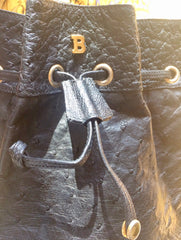 80's vintage BALLY genuine black ostrich leather hobo bucket shoulder bag with golden B logo and drawstrings.