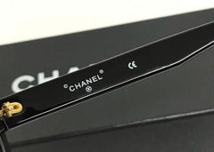 Vintage CHANEL black round frame mod sunglasses with white CHANEL PARIS logo. 060412