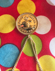 Vintage CHANEL Gold tone brooch with 2.55 classic purse and CC charms. Chic dangling brooch