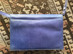 Vintage Valentino Garavani blue leather clutch shoulder bag with brown and golden logo plate at front. Gathered design.