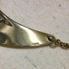 Vintage Celine gold tone crescent moon shape necklace with silver triomphe logo. 05062810