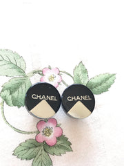 Vintage Chanel round earrings with silver and black mod design.