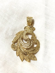 MINT. Vintage Yves Saint Laurent golden arabesque design pendant top. YSL leaf design top. Enjoy it with your own necklace.
