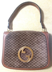 Vintage Gucci brown leather micro GG print shoulder bag with iconic golden large round GG motif. Rare masterpiece purse.