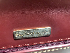 Vintage Cartier wine leather clutch bag, mini document purse with logo motif. Unisex bag from must de Cartier Collection.