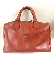 Vintage Yves Saint Laurent brown leather handbag with YSL marks. Classic unisex use bag, speedy bag.