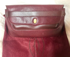 Vintage Cartier wine leather clutch bag with gold tone logo motif. Classic purse from must de Cartier Collection. 060926re8