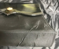 Vintage Christian Lacroix black patent enamel and nylon combo clutch bag with a sun flower shape logo motif.