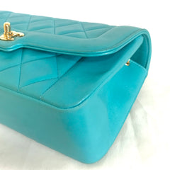 Vintage CHANEL emerald blue 2.55 chain shoulder bag with golden CC closure. Rare color purse. Must have collectible piece.