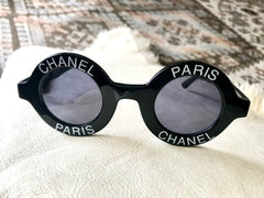Vintage CHANEL black round frame mod sunglasses with white CHANEL PARIS logo. 060412