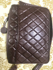 80's vintage Chanel dark brown quilted lambskin shoulder bag with CC motif and built-in chain shoulder strap. Rare Chanel purse