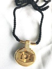 Vintage Hermes golden and red stone charm pendant top necklace with black strings. Unique jewel piece from PARFUM Collection. 060919re1