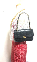 80's vintage Chanel black 2.55 shoulder bag with wavy stitches and rope strings and gold chain strap. Very rare piece from the era