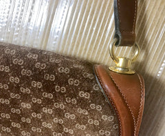 Vintage Gucci brown leather micro GG print shoulder bag with iconic golden large round GG motif. Rare masterpiece purse.