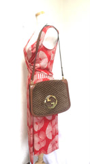 Vintage Gucci brown leather micro GG print shoulder bag with iconic golden large round GG motif. Rare masterpiece purse.