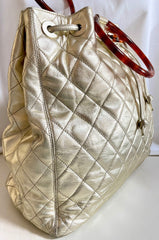 Vintage CHANEL campaign gold lamb leather hobo bucket bag with marble hoop handles and turn lock CC. 0412081