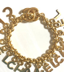Vintage Chanel Turnlock CC closure and CHANEL letter dangle bracelet. Must have 90s jewelry. CC and logo letter charm bracelet. 060801re