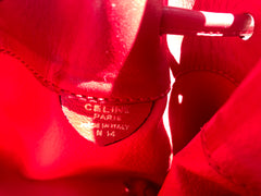 Vintage Celine red leather hobo bucket shoulder bag with a golden square logo motif and matching pouch. Classic drawstrings purse.