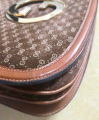 Vintage Gucci brown leather micro GG print shoulder bag with iconic golden large round GG motif. Rare masterpiece purse.