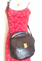 Vintage GUCCI dark brown genuine ostrich leather fisherman bag style shoulder bag with logo embossed motif. Rare masterpiece.