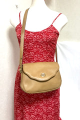 Vintage Gucci nude brown leather shoulder bag with golden and silver tone GG logo motif and wavy design flap. Classic purse. 060716r