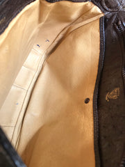 Vintage GUCCI dark brown genuine ostrich leather fisherman bag style shoulder bag with logo embossed motif. Rare masterpiece.