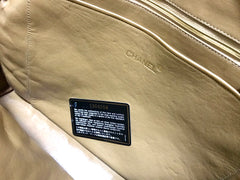80's Vintage CHANEL brown lambskin large classic bag with double golden chain strap and a CC pull charm.