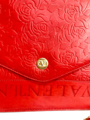 Vintage Valentino Garavani red leather chain shoulder bag with rose flower embossed design and round V motif. Can be clutch bag.