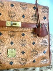 Vintage MCM classic brown monogram Kelly bag with golden logo plate. Perfect daily use bag. By Michael Cromber, Germany