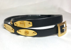 Vintage CHANEL black belt with golden buckle and iconic logo motifs, CC mark, camellia flower, turtle, perfume, clover. R0410113