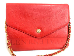 Vintage Valentino Garavani red leather chain shoulder bag with rose flower embossed design and round V motif. Can be clutch bag.