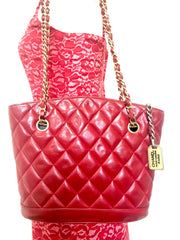 Vintage CHANEL lipstick red quilted lambskin leather trapezoid shape tote bag with a gold CC plate and chains.