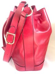 Vintage Celine red leather hobo bucket shoulder bag with a golden square logo motif and matching pouch. Classic drawstrings purse.