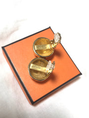 Vintage HERMES gold tone round earrings with knot button design. Fabulous jewelry piece back in the old era.