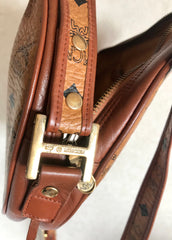 Vintage MCM brown monogram round Suzy Wong shoulder bag with brown leather trimmings. Designed by Michael Cromer. Classic masterpiece bag.