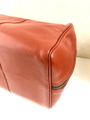 Vintage Yves Saint Laurent brown leather handbag with YSL marks. Classic unisex use bag, speedy bag.