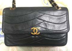 80's vintage Chanel black 2.55 shoulder bag with wavy stitches and rope strings and gold chain strap. Very rare piece from the era