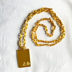 Vintage Celine golden long necklace with blaison macadam charms and square plate with embossed logo and carriage. 041032